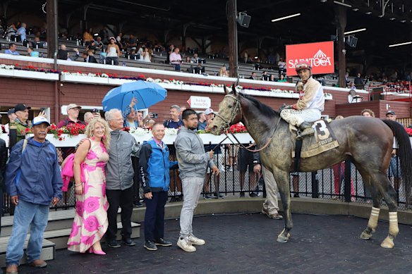 A mud-splattered Parchment Party after winning the Belmont Gold Cup in the US.