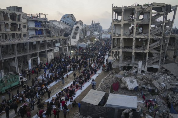 Surrounded by destroyed homes and buildings, Palestinians gather for iftar, the fast-breaking meal during Ramadan in the northern Gaza Strip on the weekend.
