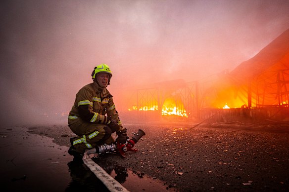Firefighters try to put out a fire at a city marketplace following a Russian missile and drone attack in Kyiv, Ukraine.