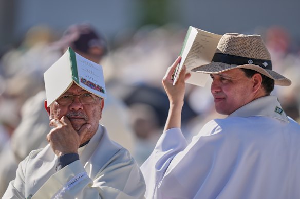 Priests wait for the arrival of Pope Leo XIV ahead of a Holy Mass and Corpus Christi procession at Plaza de Cibeles in Madrid, Spain, on the second day of his seven-day apostolic visit to mainland Spain and the Canary Islands.