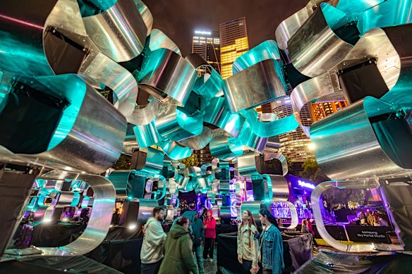 The scale of the Invisible Cities installation at Circular Quay is emphasised by including human subjects in the frame, and getting close and filling the frame. Exposure 1/25 sec at f2.8, focal length 15mm, lens 15-35mm, ISO 4000, hand held.