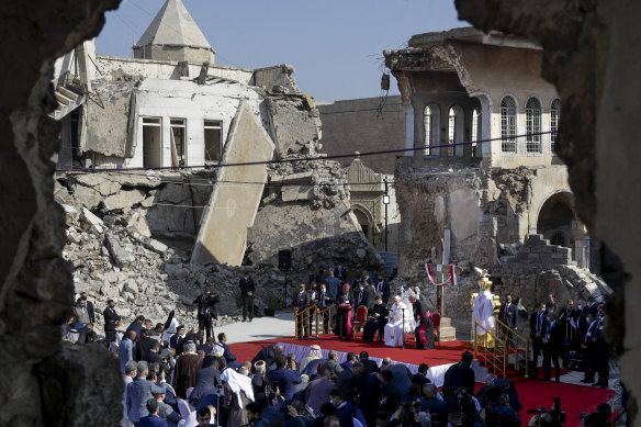 Pope Francis leads a prayer for the victims of war at Hosh al-Bieaa Church Square in Mosul in 2021.