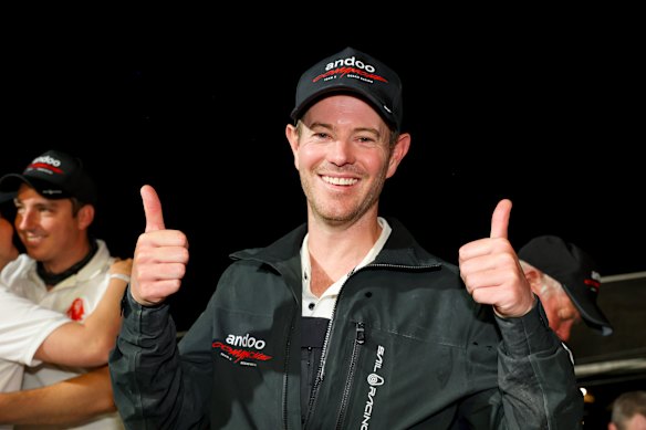 John Winning Jr aboard Andoo Comanche after taking line honours in the 2022 Sydney to Hobart yacht race.