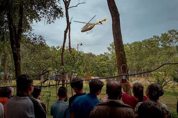 A rescue helicopter takes off from a military camp, in Trishuli, Nepal. 