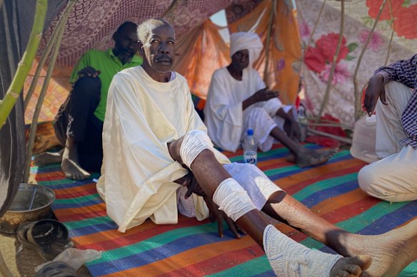 An injured man who fled El Fasher seeks shelter at the refugee camp in Tawila on Friday.