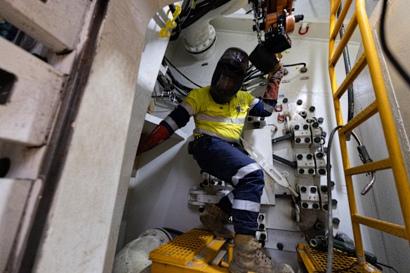 A worker inside the tight confines of the boring machine named Patyegarang.