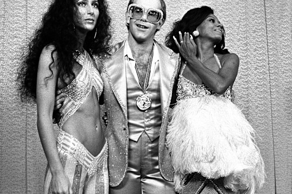 Cher, Elton John and Diana Ross at a rock awards show in Santa Monica, California, in 1975.