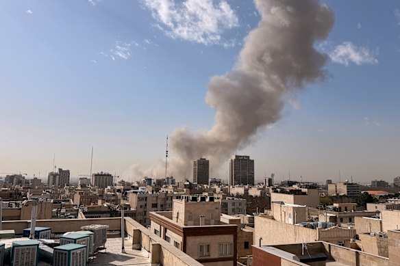 Smoke rises on the skyline following an explosion in Tehran after a targeted strike by Israel. 