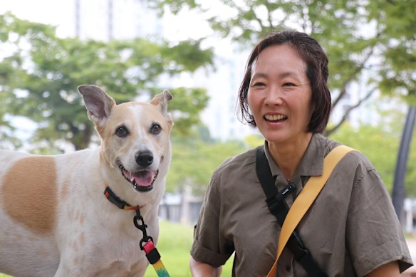 Cha Hee-jung, 48, with her dog Dodam who she rescued from a dog meat farm eight years ago. 