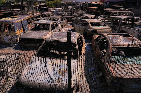 Burnt vehicles in a parking yard in Chapiner&iacute;a, Spain, on Monday.