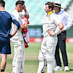 Steve Smith of Australia (right) reacts after he got hit on the helmet from the bowling of Anrich Nortje.
