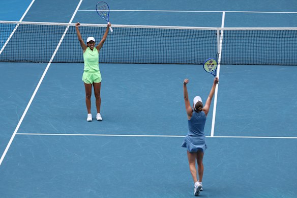 Shuai Zhang and Elise Mertens celebrate their win.