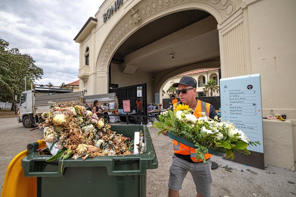 The memorial was flooded with flowers, candles, handwritten notes, flags, and other sentimental items following last Sunday’s attack.