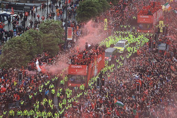 The open-top bus parade brought jubilant Liverpool fans onto the streets en masse.
