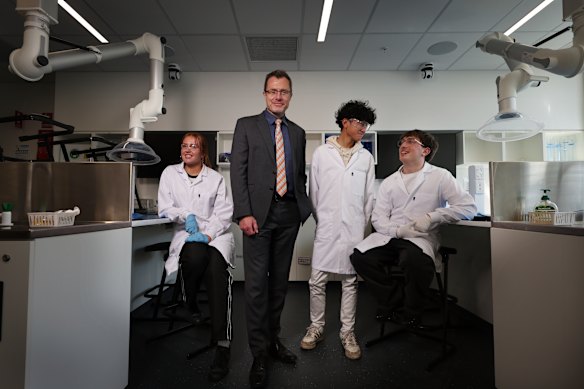 Stewart Milner, principal of the centre for Higher Education Studies, says the  government school is sparking enthusiasm among its students for university study. Milner is pictured with students (from left) Claire, Kaysar and Oscar. 