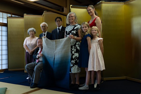 Tasmanian convict descendant Julie Findlay (centre) and her family pictured with descendants of the samurai who repelled the Cyprus.