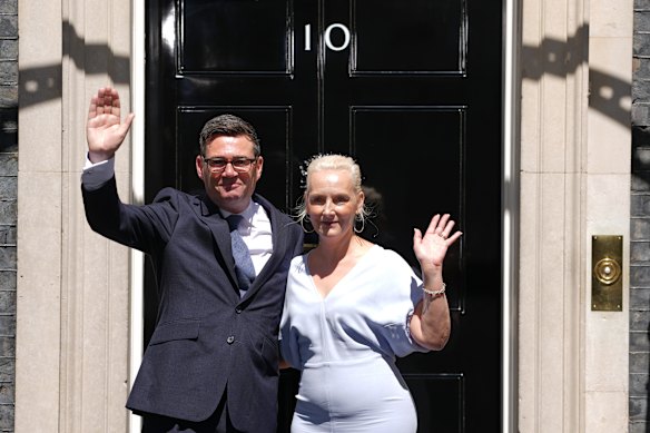 Andy Burnham and Marie-France van Heel wave as they enter 10 Downing Street.