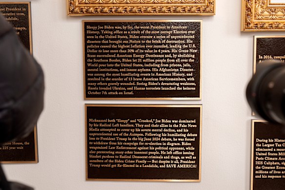 The plaques beneath a framed portrait in the space for Biden, which Trump had previously replaced with a picture of an autopen.