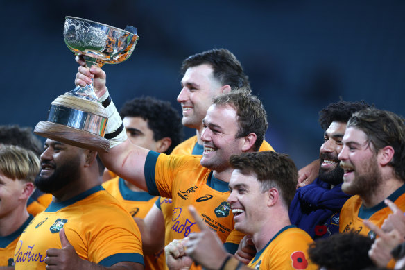 Australian captain Harry Wilson with the Ella-Mobbs trophy.