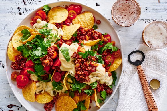 Beef and bean nachos with jalapeno cheese sauce.