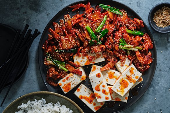 Stir-fried pork and kimchi with boiled tofu.
