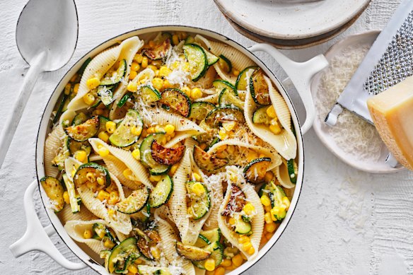 Pasta shells with zucchini and corn.
