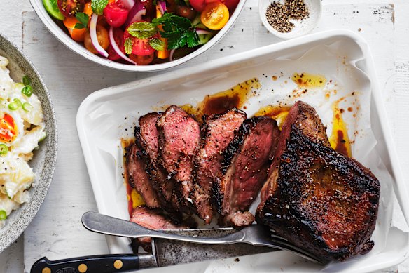 Barbecued lamb leg with tomato and mint.