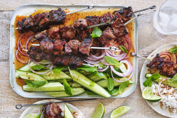 Coconut and lemongrass pork skewers with chilli-vinegar sauce.