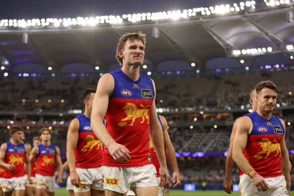 Harris Andrews of the Lions leads the team from Optus Stadium after a loss to Fremantle. 