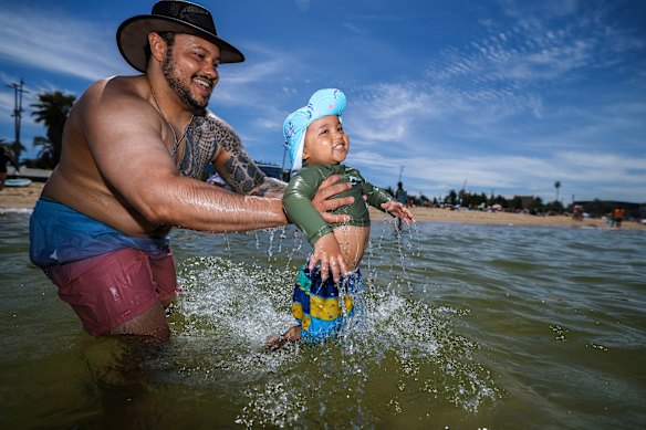 Beach-goers Declan and Caliber, 2, enjoy some of the last hot weather on offer in 2025. 