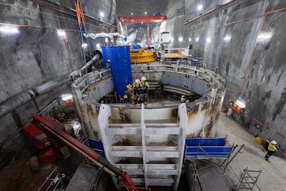 Workers on part of the boring machine named Patyegarang, which is being assembled deep beneath Birchgrove.