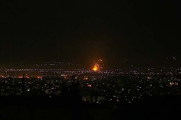An explosion is seen in Tehran, Iran, on Sunday night.