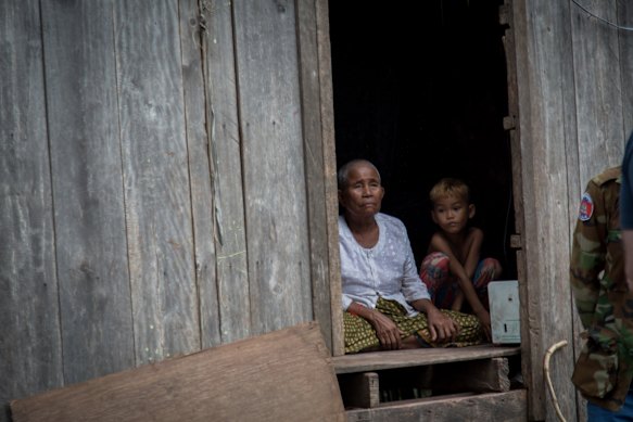 Em Heap in her small wooden house in Kampenh village. 