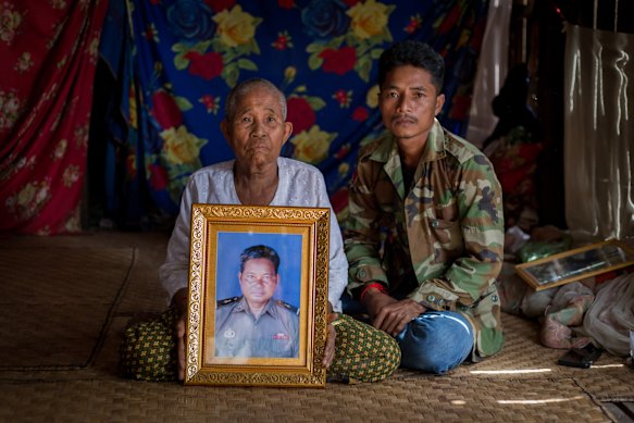 Suon Roun’s mother, Em Heap, and brother Suon Eung in their home in Kampenh village in Cambodia. 
