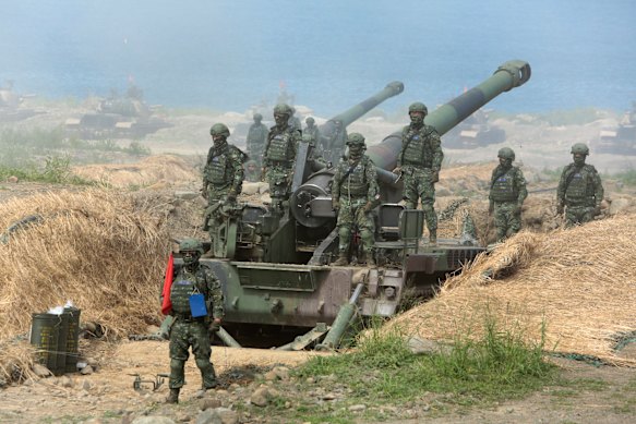Taiwanese forces conducting an anti-invasion drill on a beach.
