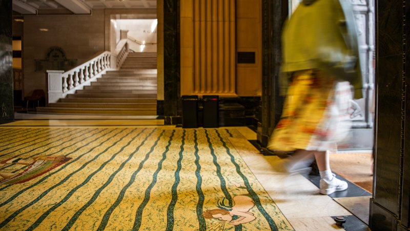 These imposing doors guard the threshold of a Sydney icon. Their troubling history has just come to light