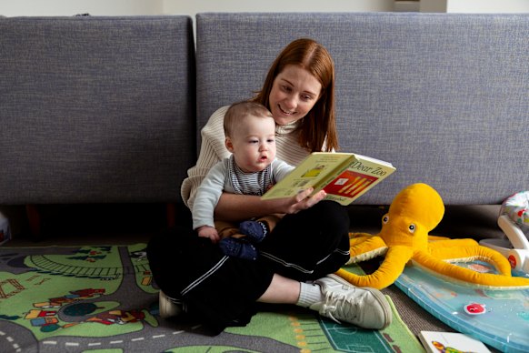 Ailish Woodhill with her 6-month-old son Mackenzie, whom she reads to regularly. 
