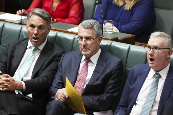 Deputy Prime Minister Richard Marles (left) and Minister for Home Affairs Tony Burke react after the Coalition’s attempt to silence Attorney-General Mark Dreyfus (centre).
