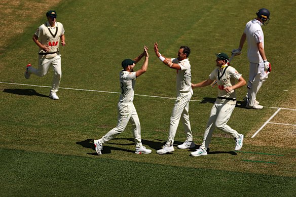 Mitchell Starc of Australia celebrates the wicket of Ben Duckett.