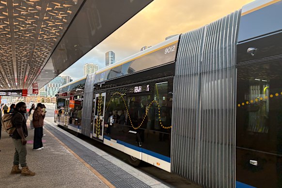 Commuters catching the Brisbane Metro service from the Cultural Centre station.