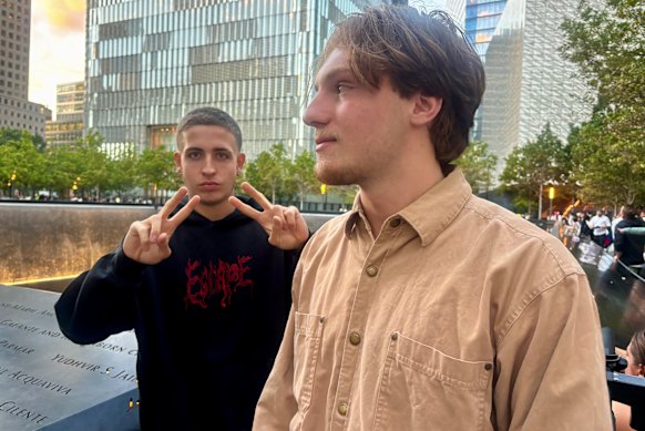 Two men who gave their names as John, 19, and Frank Catalanello, 18, at the September 11 memorial in New York.