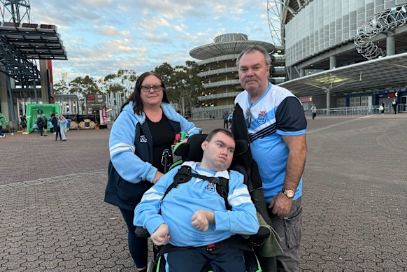 Kim, Zeke and Stephen Taylor at the Origin decider in Sydney On July 9.
