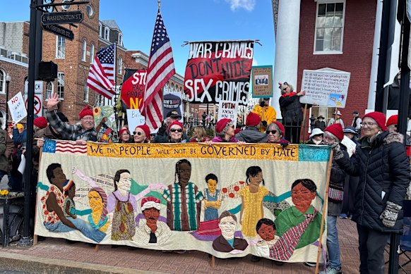 Anti-Trump demonstrators held signs and sang protest songs.