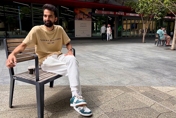 Parramatta local Biwash Ojha relaxes with a coffee at Parramatta Square.