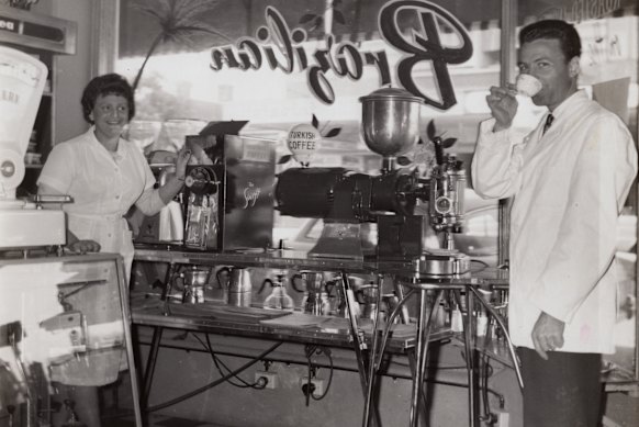  Anne Ferrari, left, with an early coffee roasting machine.