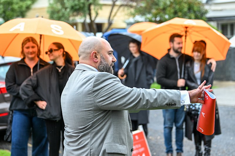Auctioneer John Galea selling the Footscray home.