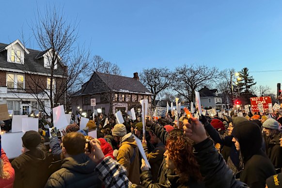 Protesters gather at a vigil for the woman shot in Minneapolis.