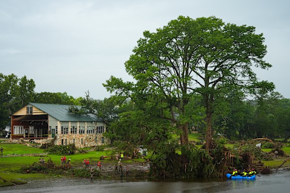 Rescue workers search for missing people near Camp Mystic.