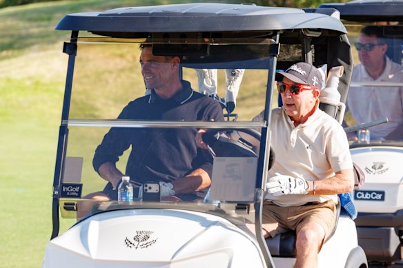 Dan Carter with jockey Jim Cassidy during a round of golf at the Bonnie Doon Golf Club.