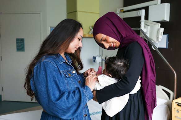 Hamna Aftab and her baby, Lulu,  with midwife Amar Hamed at Auburn Hospital.